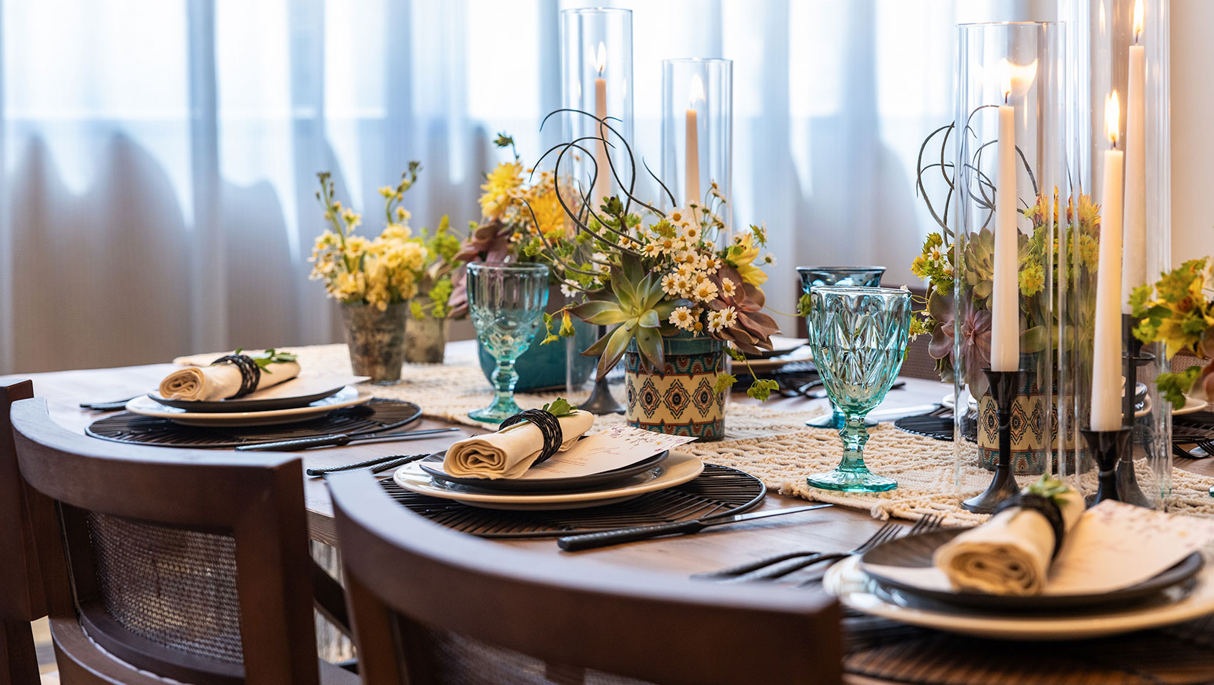 Calavera Junior Ballroom Table Set with flowers, candles, blue glasses