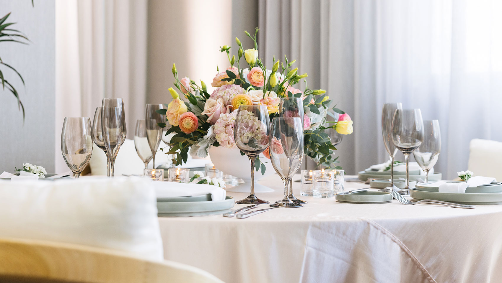 Wedding Reception table set up with flowers and dinnerware