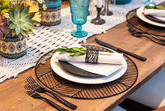 Wedding Reception table set up black accents and succulents and blue glasses