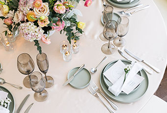 Wedding Reception table set up with flowers and dinnerware