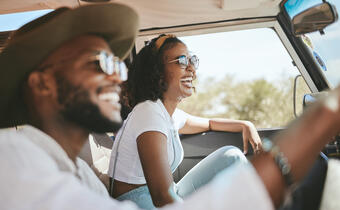 Couple driving in car