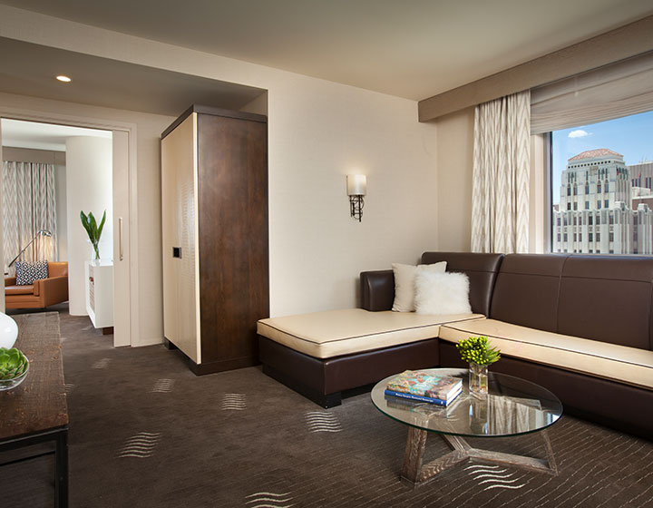 Kimpton Hotel Palomar Phoenix Suite Living Area with sofa and coffee table prior to renovation
